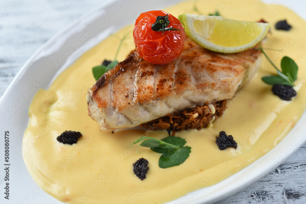 grilled fish fillet with vegetable puree, tomatoes and lemon grilled fish fillet with vegetable puree, tomatoes and lemon