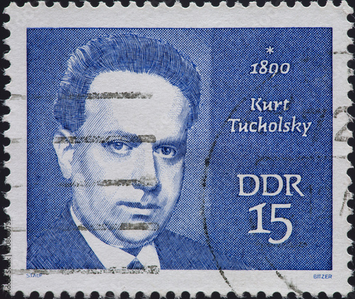 GERMANY, DDR - CIRCA 1970: a postage stamp from GERMANY, DDR, showing a portrait of the writer Kurt Tucholsky (1890–1935) . Circa 1970 photo