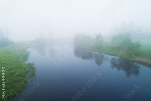 High angle view to a misty river landscape on a late spring morning in Estonia, Northern Europe