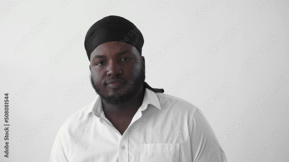 Approving man. Head nod. Yes gesture. Boomerang motion. Serious agreeing black African guy isolated on light free space background GIF loop animation. Approving man. Head nod. Yes gesture. Boomerang motion. Serious agreeing black African guy isolated on light free space background GIF loop animation.