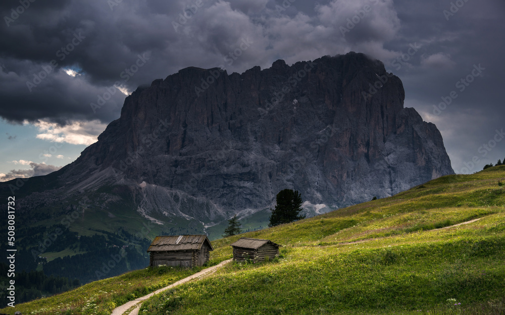 Fototapeta premium Mountains above Val Gardena mountain pass in the Dolomites