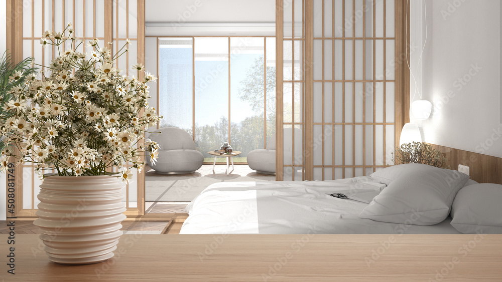 Wooden table top or shelf with pottery vase with daisies, wild flowers, over modern bedroom with double bed, japanese style, panoramic window, minimalist interior design concept