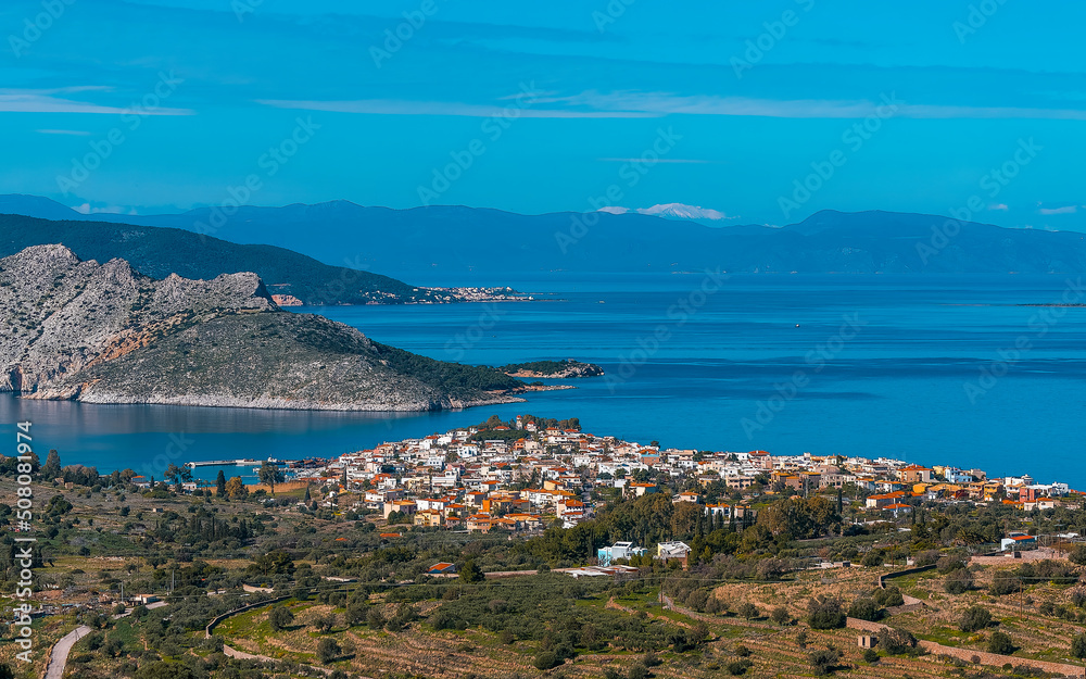 From a low peak on the island of Aegina, Greece, we see the town of Perdika, the Moni and Agistri islands, and in the background the Peloponnese.