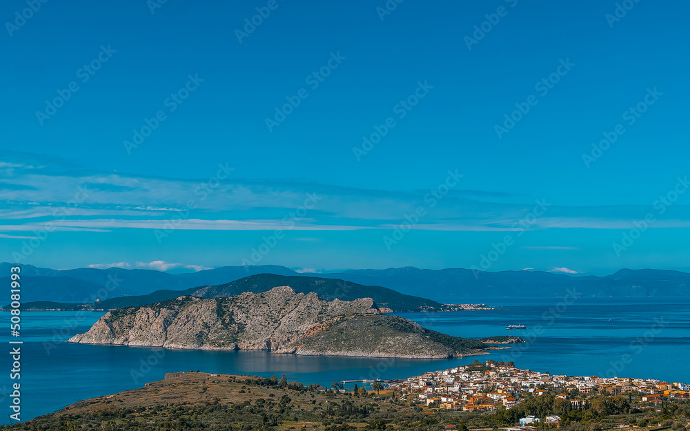From a low peak on the island of Aegina, Greece, we see the town of Perdika, the Moni and Agistri islands, and in the background the Peloponnese.