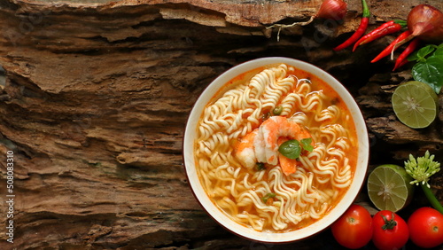 instant noodles with shrimp on wooden background photo