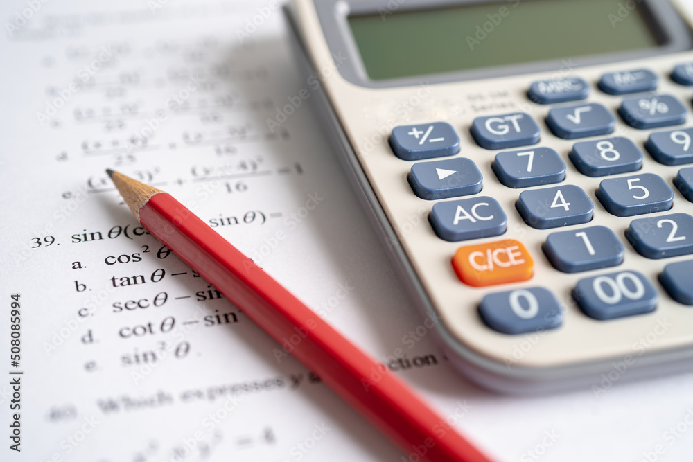 Pencil on mathematic formula exercise test paper in education school. Pencil on mathematic formula exercise test paper in education school.