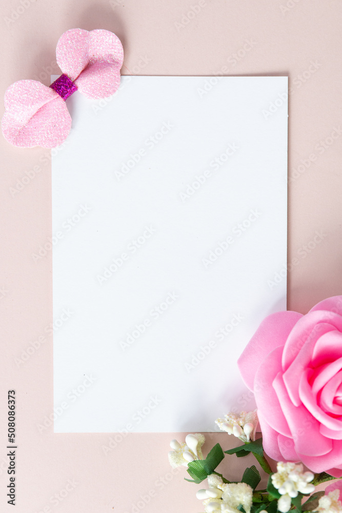 Cute sparkly toys and flowers on light-pink background with space for text. Template for a card with an invitation to the Gender reveal party. Baby shower invintation 