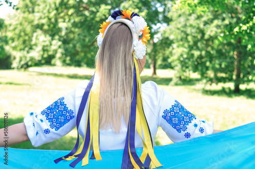Ukrainian girl with a yellow and blue national flag of Ukraine