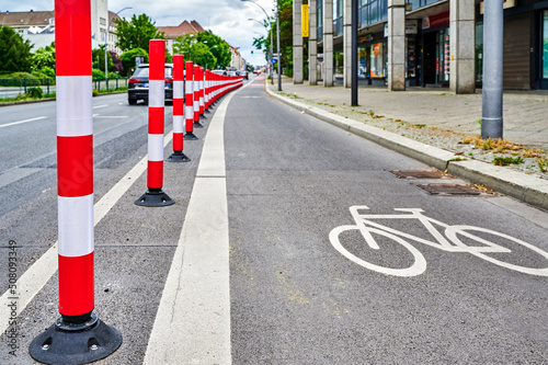 Separated bike lane on a main street in Berlin to improve road safety at the expense of parking lane. photo