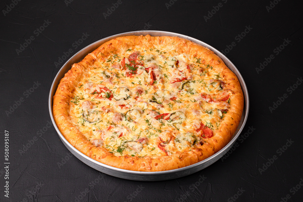 Homemade pizza, pizza on a black background, Georgian cuisine Homemade pizza, pizza on a black background, Georgian cuisine