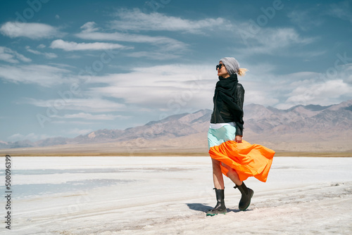 asian woman walking on saline alkali land photo