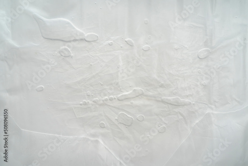 white crumpled plastic texture background, soft focus