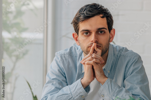 portrait of thoughtful young man making a decision photo