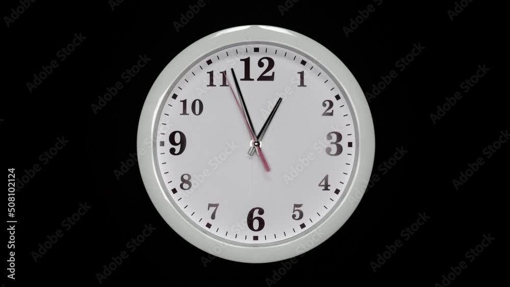 White Wall Clock With A Black Arrows And Red Second Hand On Black Background. Wall Clock Face Of Time Of 1.00 Am Or Pm. 4k. ProRes. White Wall Clock With A Black Arrows And Red Second Hand On Black Background. Wall Clock Face Of Time Of 1.00 Am Or Pm. 4k. ProRes.
