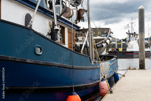 Blue commercial fishing boat at dock