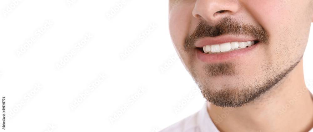 Closeup view of young man with healthy teeth on white background, space for text. Banner design