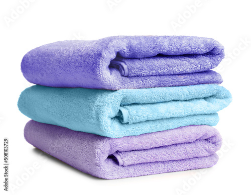 Folded soft terry towels on white background