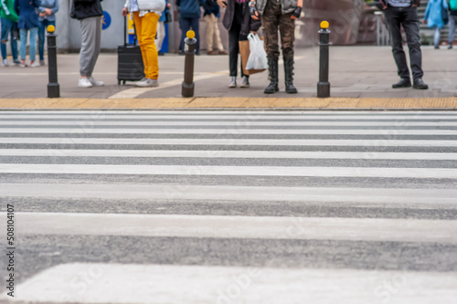 Wallpaper Mural People waiting to cross street in city, closeup Torontodigital.ca