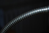 Old lamp headband, metal, spiral, on a dark background