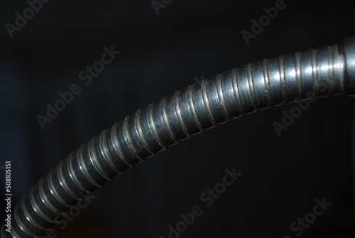 Old lamp headband, metal, spiral, on a dark background photo