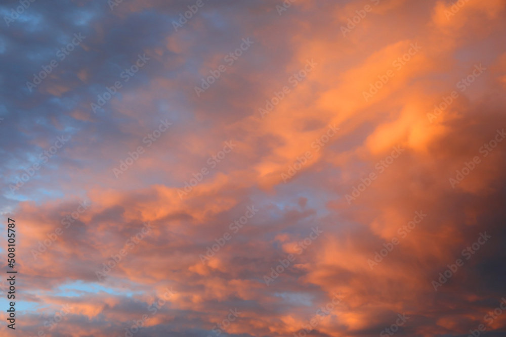blue sky and clouds with orange and pink colors in spring