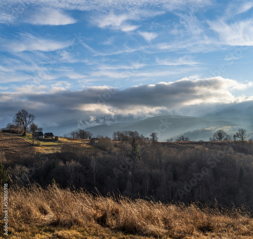 Last good weather days in autumn mountain countryside. Peaceful picturesque Ukrainian Carpathians mountains scene.