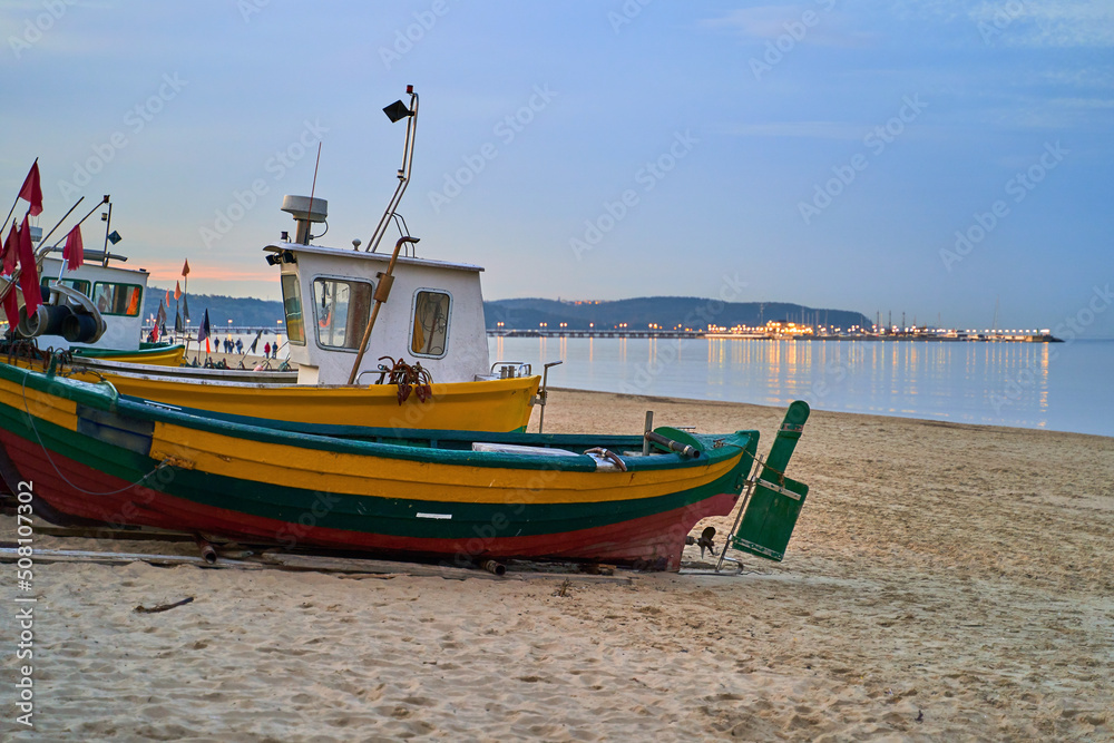 Picturesque fishing boat on beach in Sopot, Pomorskie region, Poland