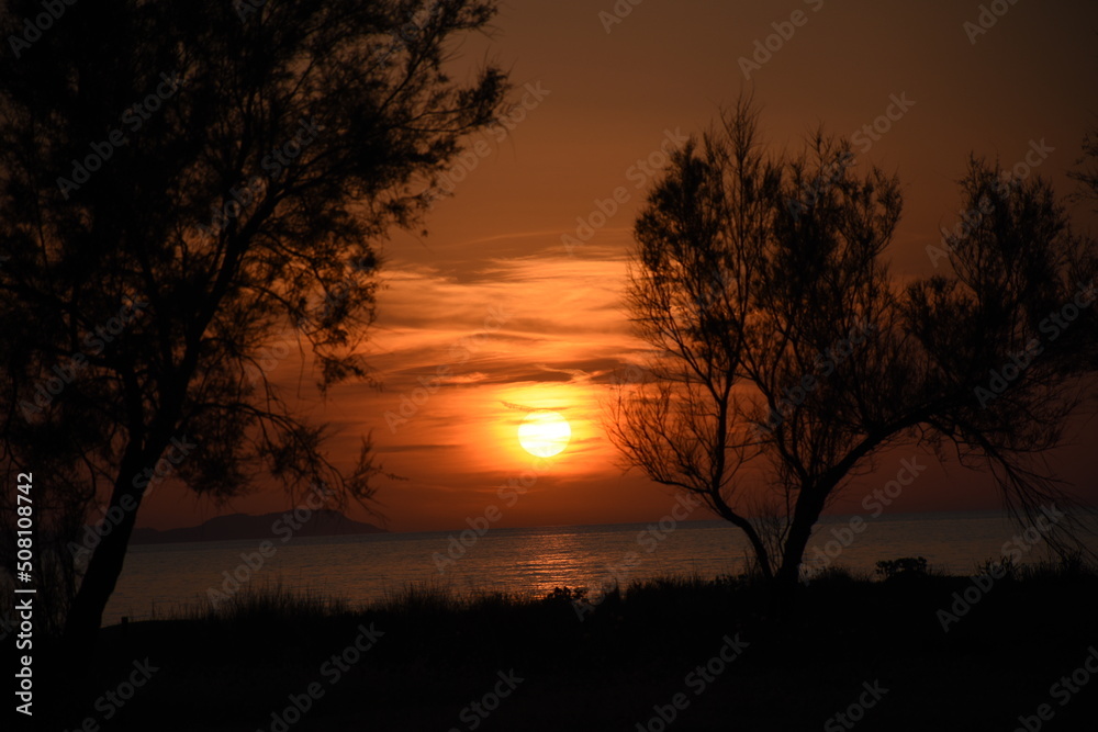 Beautiful sunset in Acharavi beach, Corfu,Greece Beautiful sunset in Acharavi beach, Corfu,Greece