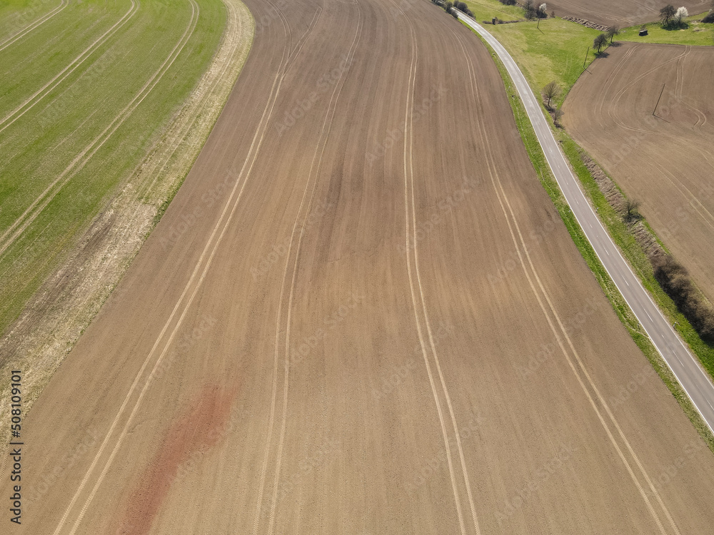 Top view of plowed field on a sunny day in spring 
