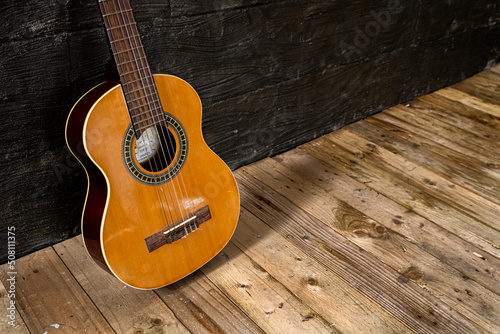 Acoustic guitar in a rustic wooden setting 