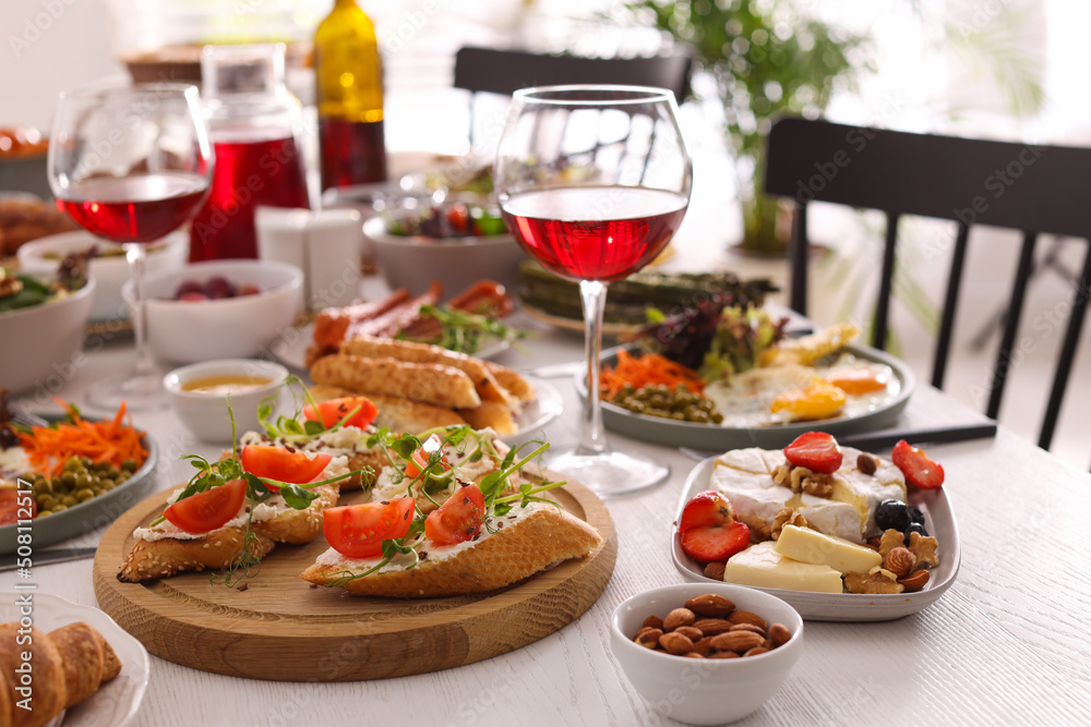 Many different dishes served on buffet table for brunch