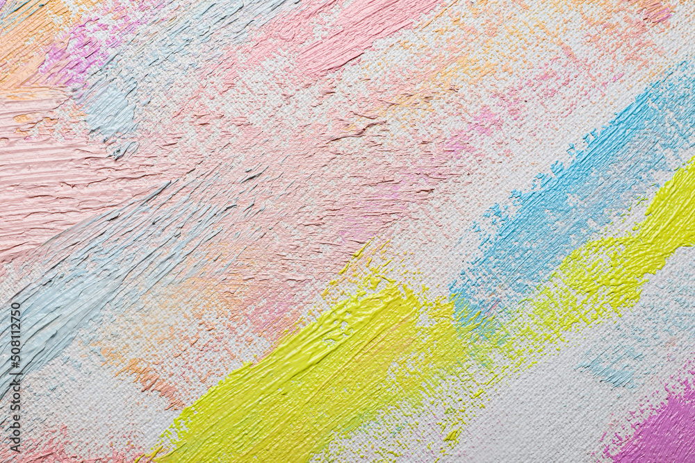 Strokes of different pastel acrylic paints on white canvas, closeup