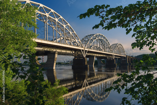 Obraz na płótnie New Darnytskyi Bridge across Dnipro river in Kyiv, Ukraine on calm spring day. w salonie