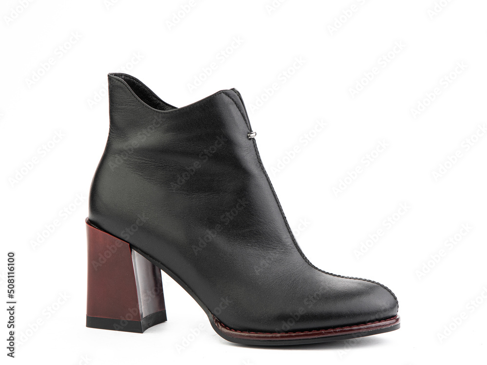 Women's autumn ankle leather boots with black zip and red average heels, isolated white background. Right side view. Fashion shoes. shoe shop concept.