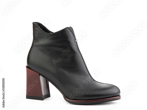 Obraz na płótnie Women's autumn ankle leather boots with black zip and red average heels, isolated white background. Right side view. Fashion shoes. shoe shop concept. w salonie