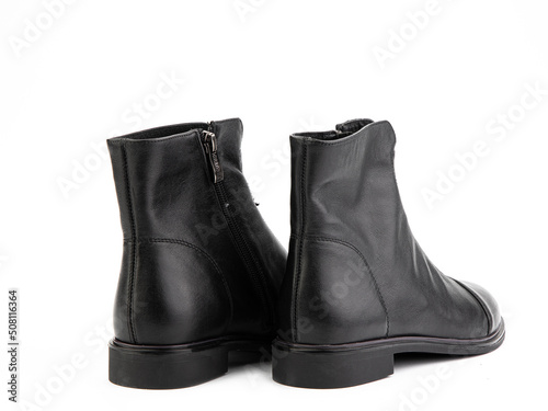 Obraz na płótnie Women's autumn black leather jodhpur boots with zip and average heels, isolated white background. Back side view. Fashion shoes. w salonie