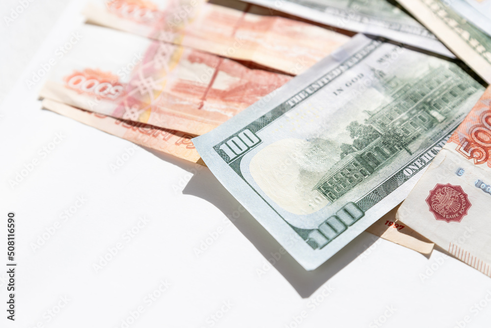 rubles lying on american dollars as a symbol of weakness russian national currency and strengthening of american dollar.financing of war and aggressive actions, no war and catastrophes.copy space rubles lying on american dollars as a symbol of weakness russian national currency and strengthening of american dollar.financing of war and aggressive actions, no war and catastrophes.copy space