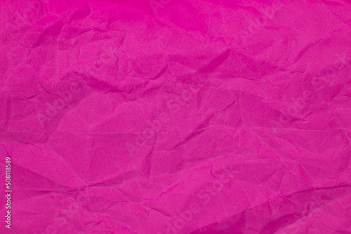 Crumpled pink paper craft textured background