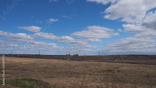 spring landscape field and blue sky