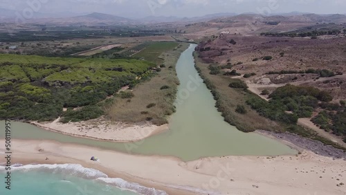 Aerial drone view of the Natural Reserve Foce del Fiume Platani and Capo Bianco in Sicily with turquoise sea and white limestone cliffs on a sunny summer day. Province of Agrigento near Eraclea Minoa. photo