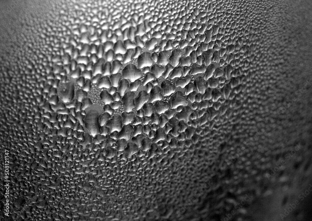 Macro background with water droplets condensation pattern on metal surface Macro background with water droplets condensation pattern on metal surface