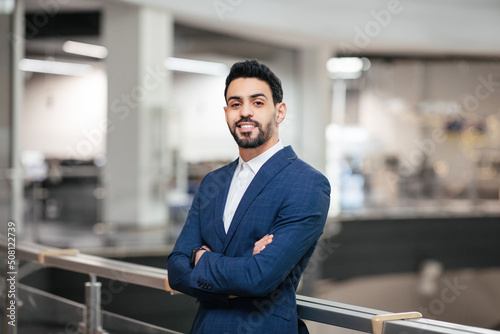 Fotografiet Smiling confident calm attractive young middle eastern businessman with beard in