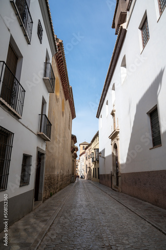 Walking in old central part of world heritage city Granada, Andalusia, Spain