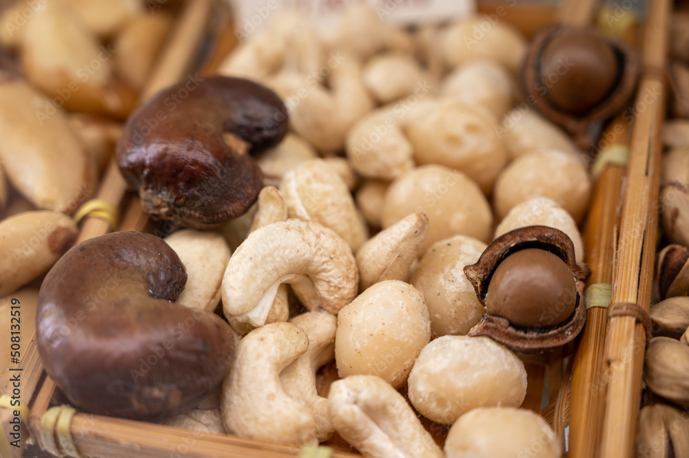 Roasted cashew and macadamia nuts, tasty healthy vegetarian food Roasted cashew and macadamia nuts, tasty healthy vegetarian food