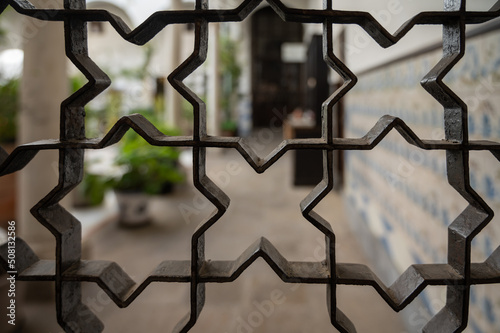 Example of moorish geometrical ornaments on iron doors in Granada, Andalusia, Spain
