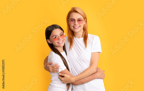 happy family portrait of single mother and daughter in glasses, family
