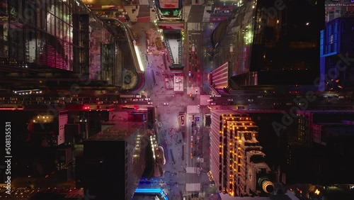 Aerial birds eye overhead top down ascending view of cars driving on streets passing through Times Square. Manhattan, New York City, USA