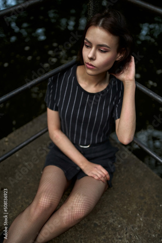Thoughtful cute girl in black clothes. © Alex
