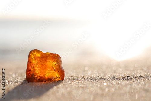 Fototapeta Naklejka Na Ścianę i Meble -  Amber washed ashore on a sandy beach