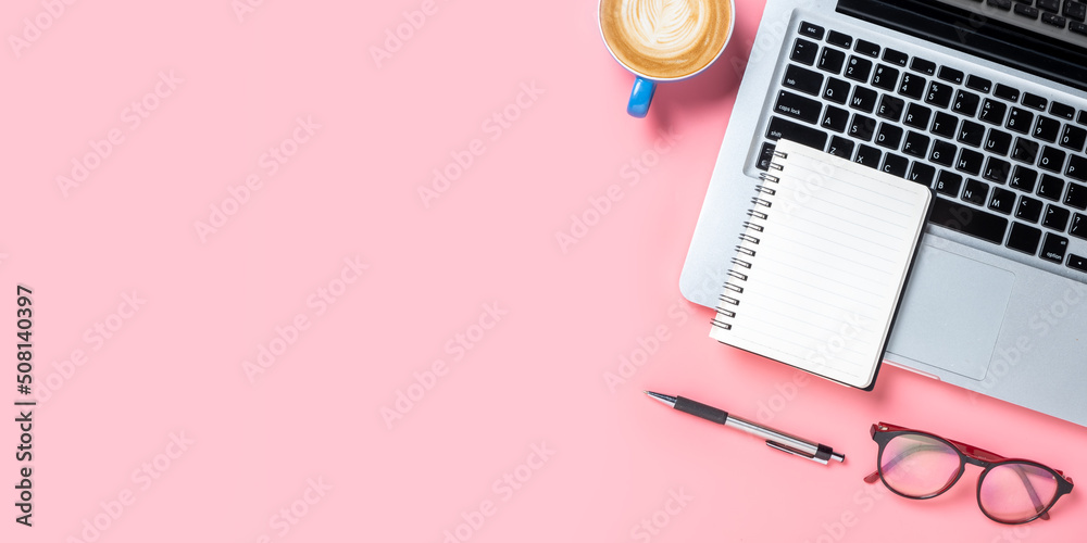 Top view, Pink Office desk with computer, Pen, eyeglass, notebook and Cup of coffee, copy space, Mock up.. Top view, Pink Office desk with computer, Pen, eyeglass, notebook and Cup of coffee, copy space, Mock up..